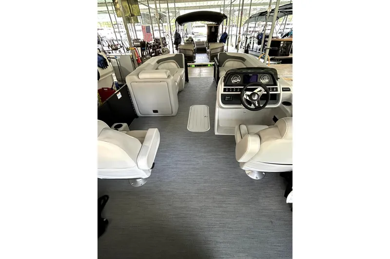 Slide: The Image of 2026 Godfrey Sweetwater 2486 SFLC pontoon boat interior with modern seating and helm. - 8
