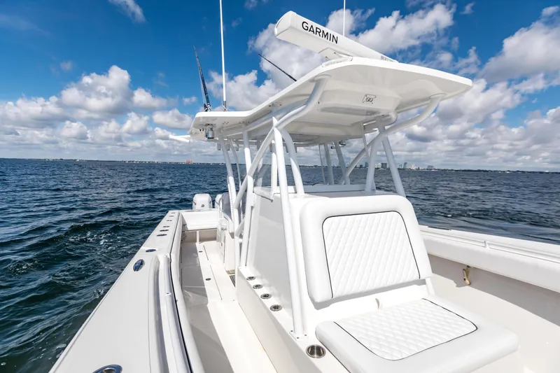 Slide: The Image of 2020 SeaHunter 33 Tournament boat on open water under a blue sky. - 10