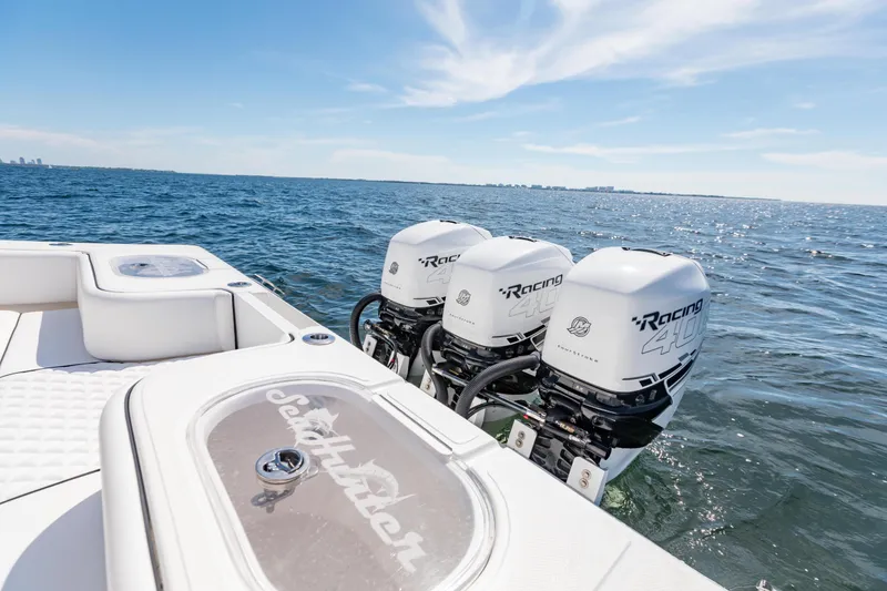 Slide: The Image of 2020 SeaHunter 33 Tournament boat with triple Racing 400 engines on open water. - 11
