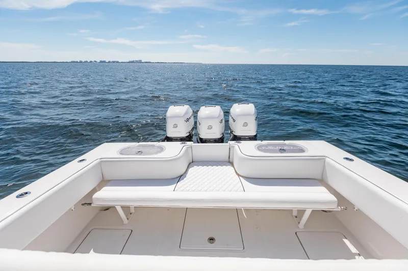 Slide: The Image of 2020 SeaHunter 33 Tournament boat with triple engines on open water. - 14