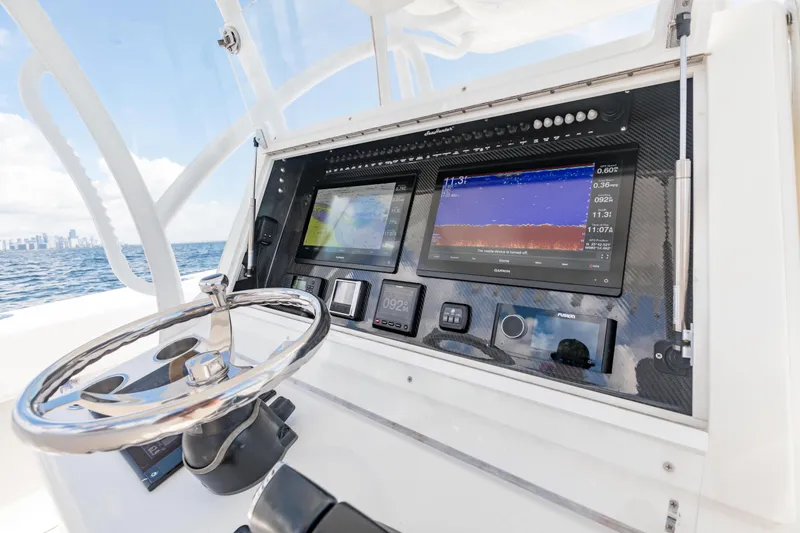 Slide: The Image of 2020 SeaHunter 33 Tournament boat dashboard with advanced navigation and control systems. - 15