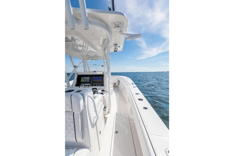 Slide: The Image of 2020 SeaHunter 33 Tournament boat interior with ocean view, featuring modern navigation equipment. - 17