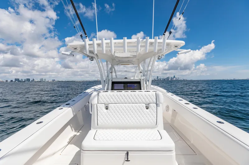 Slide: The Image of 2020 SeaHunter 33 Tournament boat on open water with city skyline in background. - 19