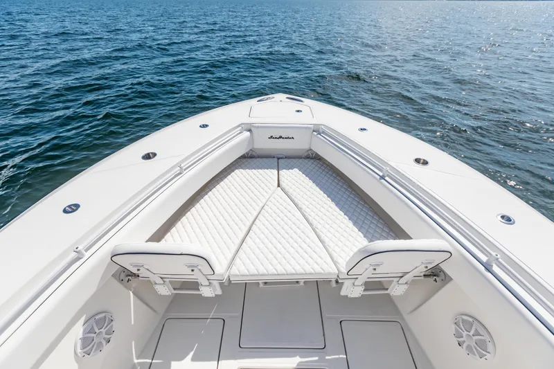 Slide: The Image of 2020 SeaHunter 33 Tournament boat bow with cushioned seating on open water. - 5