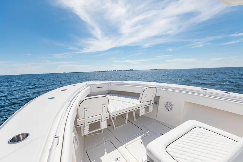 Slide: The Image of 2020 SeaHunter 33 Tournament boat on open water under a clear blue sky. - 6