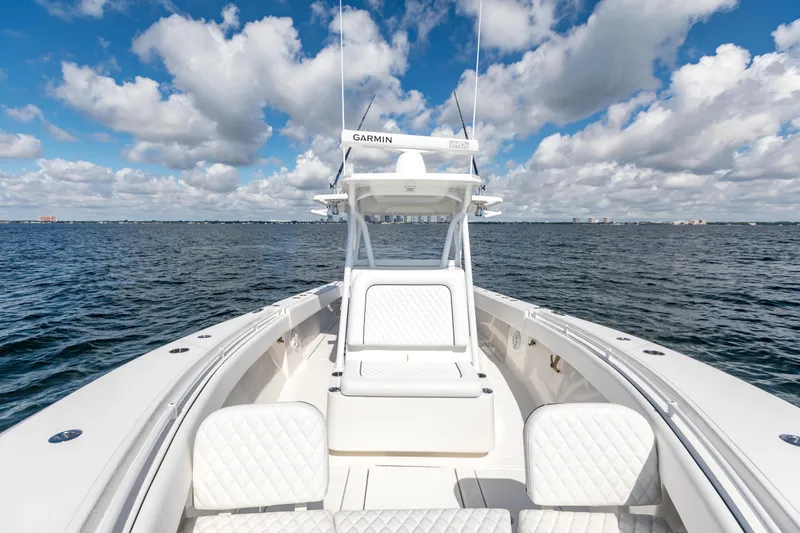 Slide: The Image of 2020 SeaHunter 33 Tournament boat on open water under a cloudy sky. - 8