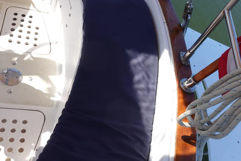 Slide: The Image of Cockpit of 1987 Tartan Marine 40 sailboat with seating and coiled rope. - 10