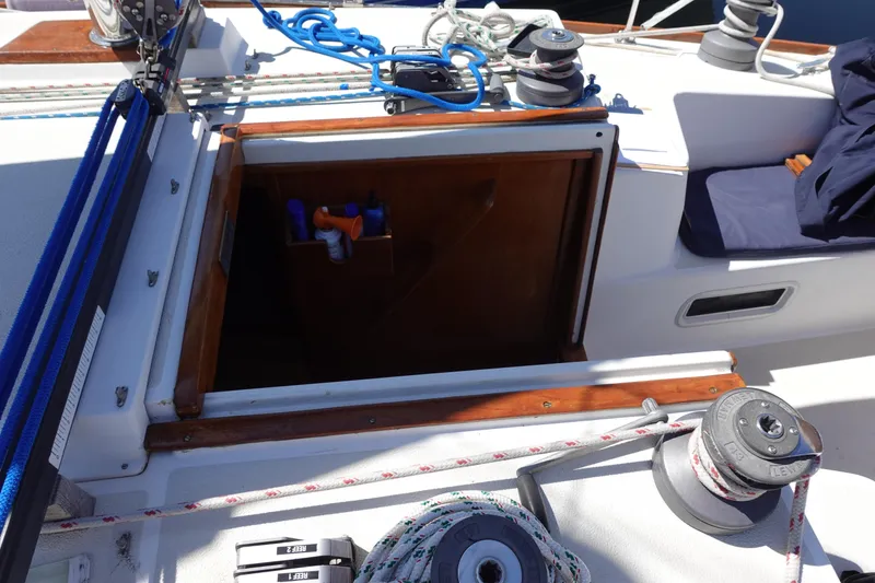 Slide: The Image of 1987 Tartan Marine 40 sailboat cockpit with open hatch and winches. - 16