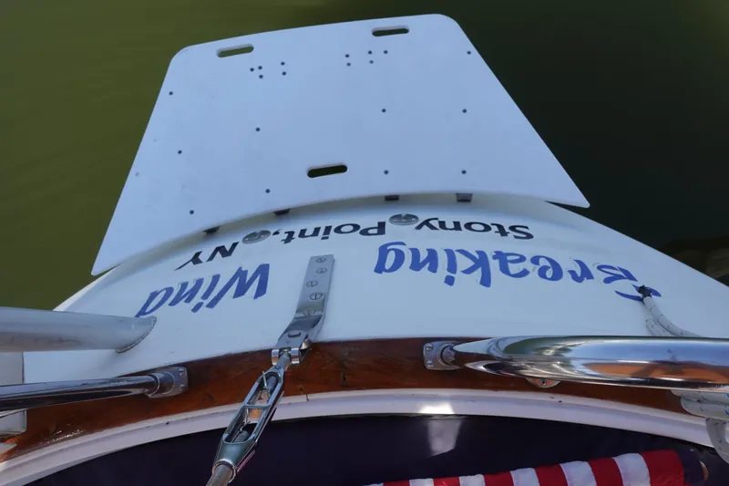 Slide: The Image of 1987 Tartan Marine 40 sailboat stern with swim platform, featuring "Freaking Wind" text. - 19