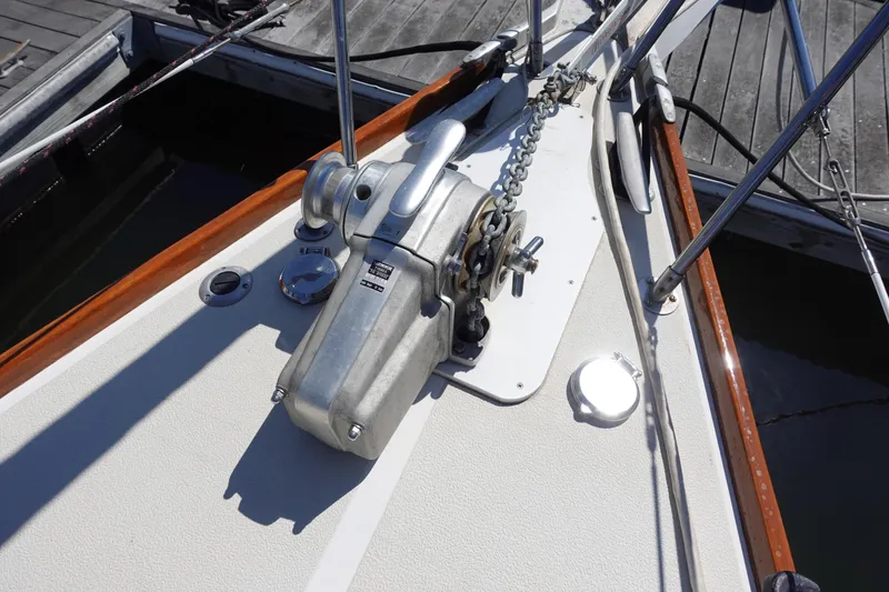 Slide: The Image of Anchor windlass on 1987 Tartan Marine by Sparman Stephens 40 sailboat deck, docked at marina. - 2
