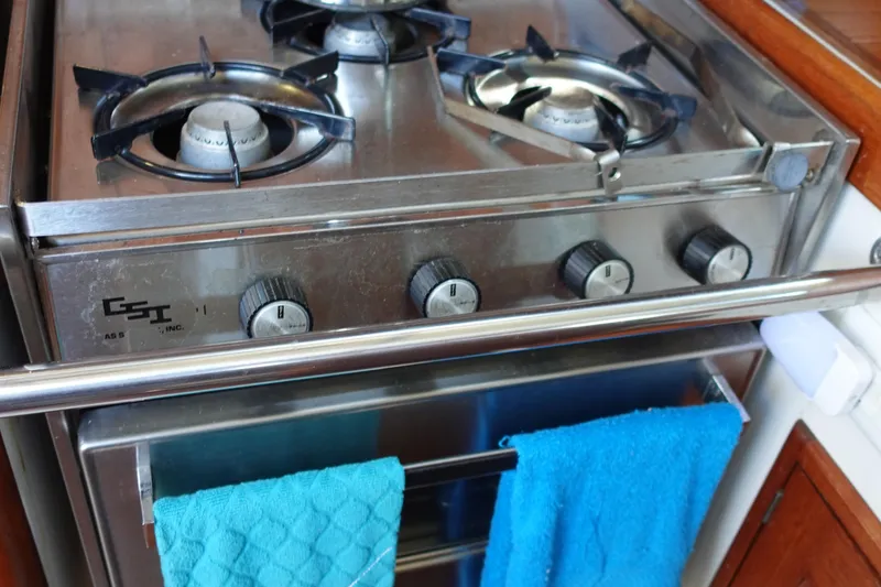 Slide: The Image of Stainless steel stove with blue towels, Tartan Marine 40, 1987 model. - 26