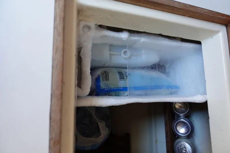 Slide: The Image of Freezer compartment in 1987 Tartan Marine by Sparman Stephens 40, with frost and stored items. - 29