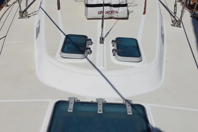 Slide: The Image of 1987 Tartan Marine 40 sailboat deck with hatches and life jackets. - 3