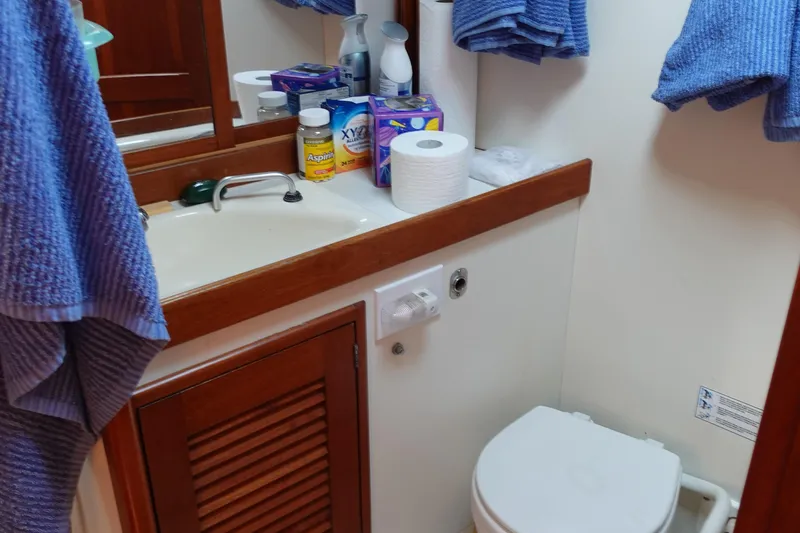 Slide: The Image of Bathroom interior of 1987 Tartan Marine by Sparman Stephens 40 yacht, featuring sink and toilet. - 42