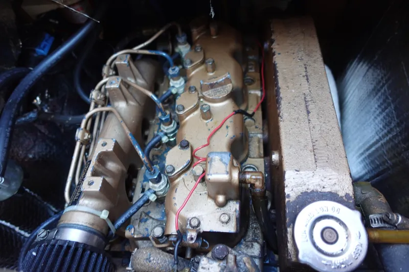 Slide: The Image of Engine compartment of a 1987 Tartan Marine by Sparman Stephens 40 sailboat, showing detailed components. - 43