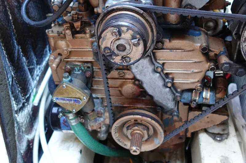 Slide: The Image of 1987 Tartan Marine by Sparman Stephens 40 engine, showing belts and components in close-up view. - 44