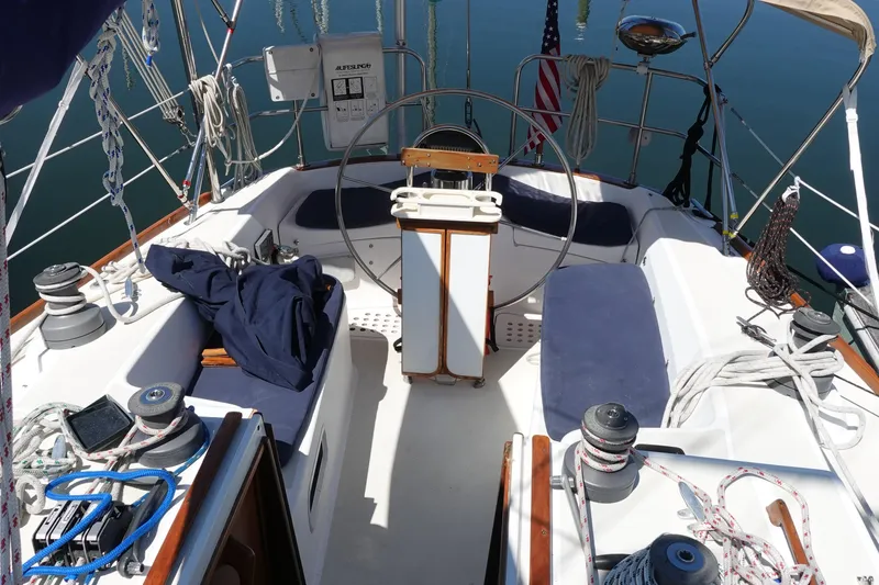 Slide: The Image of Cockpit of 1987 Tartan Marine by Sparman Stephens 40 sailboat with steering wheel and ropes. - 6