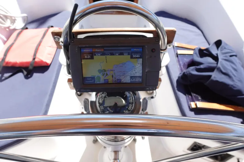 Slide: The Image of Cockpit of 1987 Tartan Marine 40 sailboat with navigation equipment and compass. - 9
