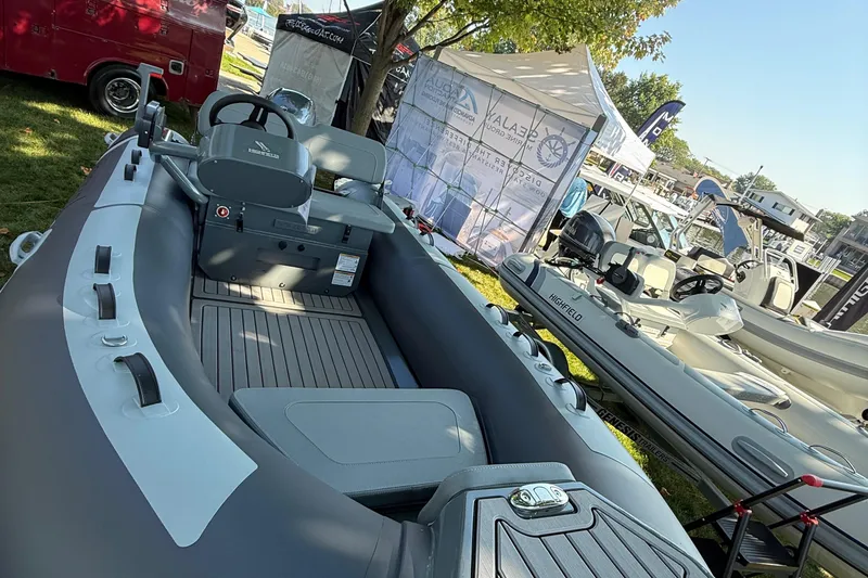 Slide: The Image of 2025 Highfield Classic 400 inflatable boat displayed at an outdoor boat show. - 5