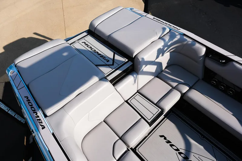 Slide: The Image of 2024 Moomba Tykon boat interior with sleek gray seating and modern design. - 12