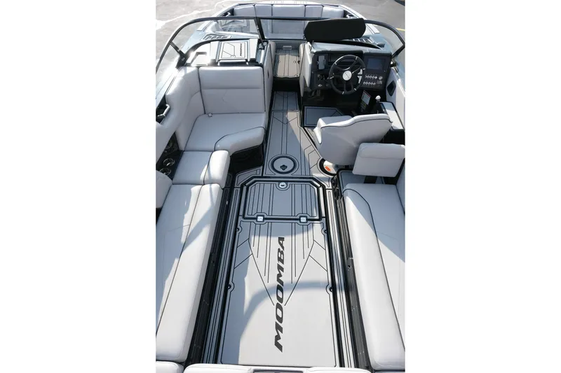 Slide: The Image of 2024 Moomba Tykon boat interior with sleek seating and modern dashboard design. - 13