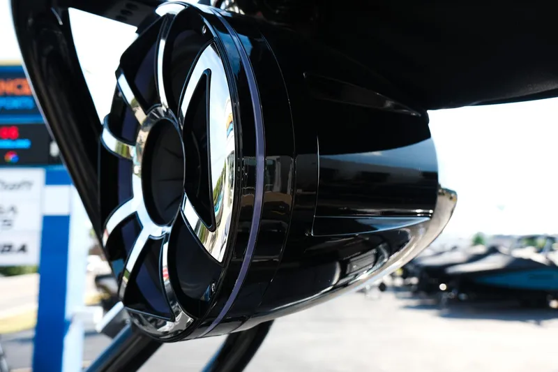 Slide: The Image of Close-up of 2024 Moomba Tykon boat speaker, showcasing sleek black and chrome design. - 15