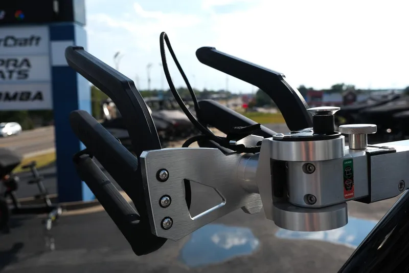 Slide: The Image of 2024 Moomba Tykon boat accessory detail with sleek metal design in outdoor setting. - 16