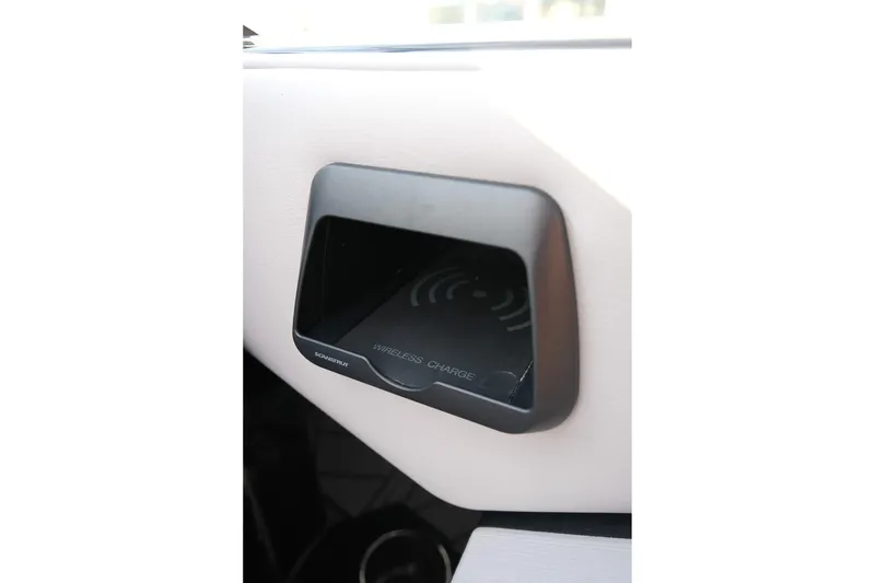 Slide: The Image of 2024 Moomba Tykon wireless charging station in vehicle interior. - 18
