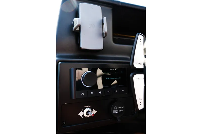 Slide: The Image of 2024 Moomba Tykon dashboard with Fusion audio system and controls. - 22