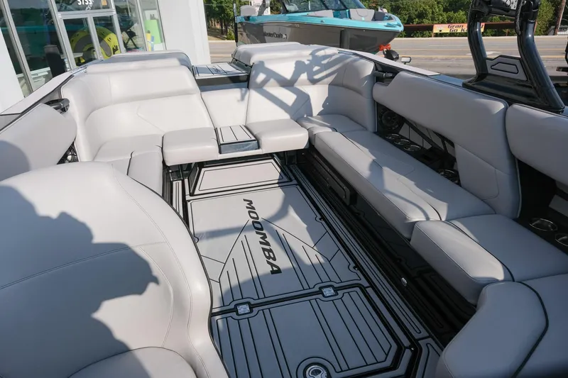 Slide: The Image of 2024 Moomba Tykon boat interior with sleek gray seating and modern design. - 26