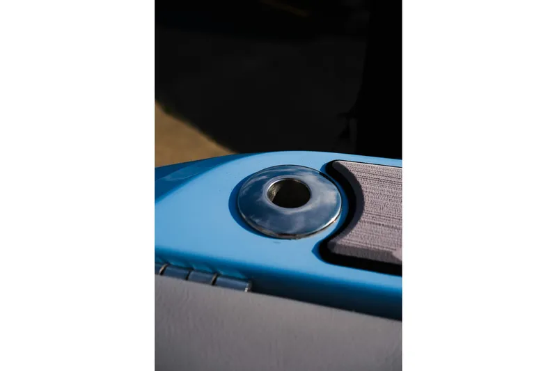 Slide: The Image of Close-up of 2024 Moomba Tykon boat detail, featuring a metallic fixture on blue surface. - 32