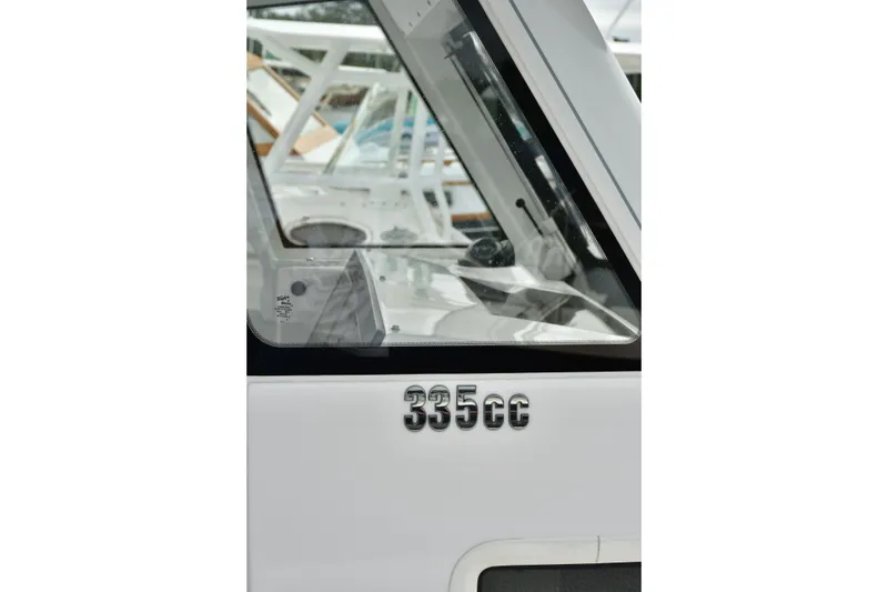 Slide: The Image of 2022 Everglades 335 Center Console boat, close-up of model number on side. - 10