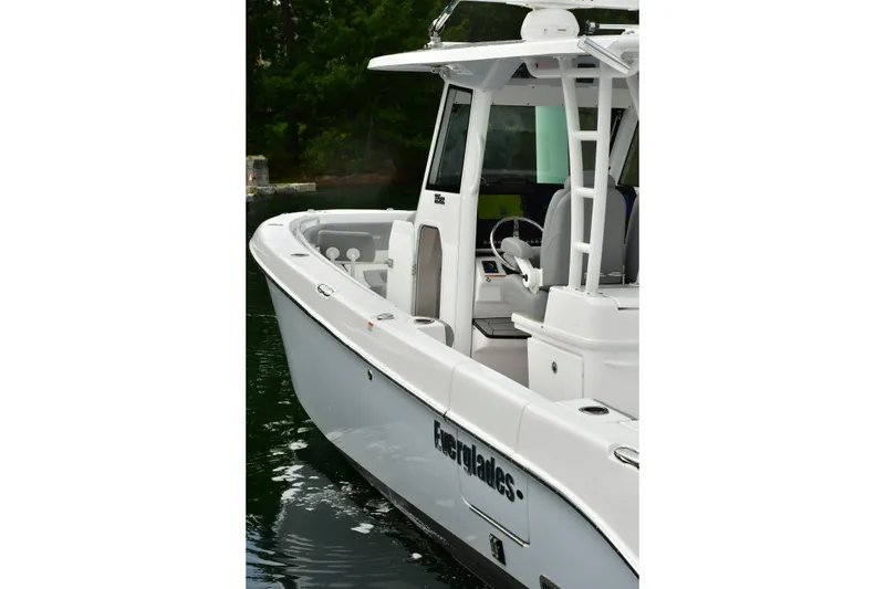 Slide: The Image of 2022 Everglades 335 Center Console boat on water, showcasing sleek design and modern features. - 21