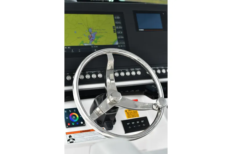 Slide: The Image of Steering wheel and dashboard of 2022 Everglades 335 Center Console boat. - 4