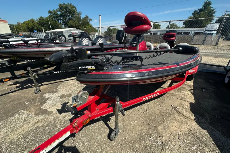 Slide: The Image of 2011 Nitro Z-6 boat with Minn Kota Terrova motor on a red trailer. - 12