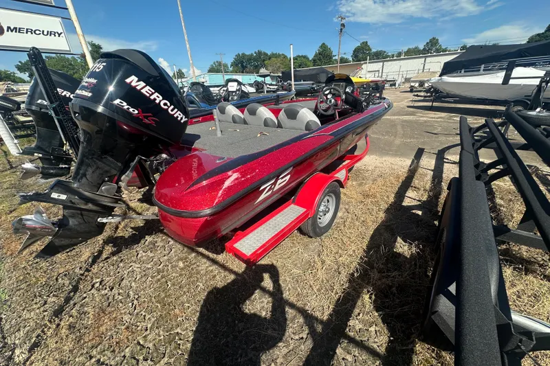 Slide: The Image of 2011 Nitro Z-6 boat with Mercury Pro XS engine, parked outdoors. - 15