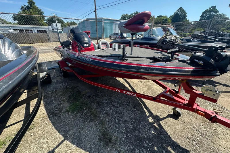 Slide: The Image of 2011 Nitro Z-6 fishing boat on trailer, equipped with Minn Kota motor. - 9