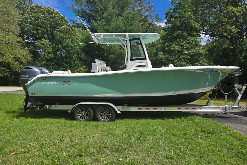 The Image of 2023 Sea Hunt Ultra 265 SE boat on trailer, displayed outdoors. - 0