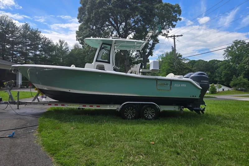 Slide: The Image of 2023 Sea Hunt Ultra 265 SE boat on trailer, side view. - 3