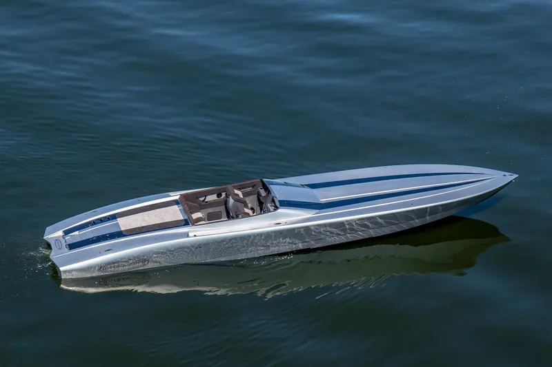 Slide: The Image of 2020 Outerlimits SL-50 speedboat cruising on calm blue water. - 1