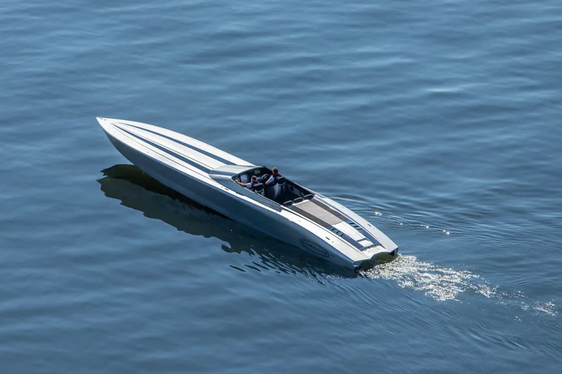 Slide: The Image of 2020 Outerlimits SL-50 speedboat cruising on calm blue water. - 15