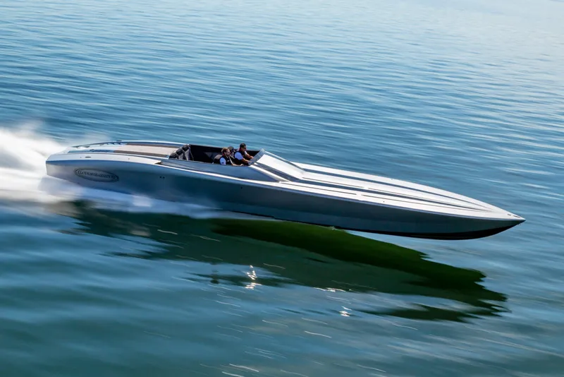 Slide: The Image of 2020 Outerlimits SL-50 speedboat cruising swiftly on calm blue water. - 3