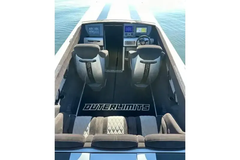 Slide: The Image of 2020 Outerlimits SL-50 boat interior with modern dashboard and seating. - 6