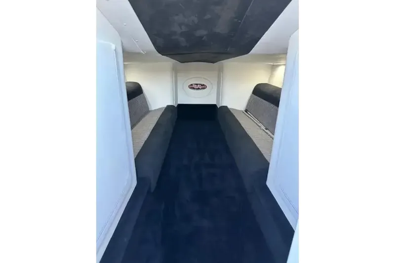 Slide: The Image of Interior of 2020 Outerlimits SL-50 boat, featuring sleek seating and modern design. - 7