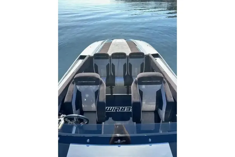 Slide: The Image of 2020 Outerlimits SL-50 boat interior with sleek seating on calm water. - 9