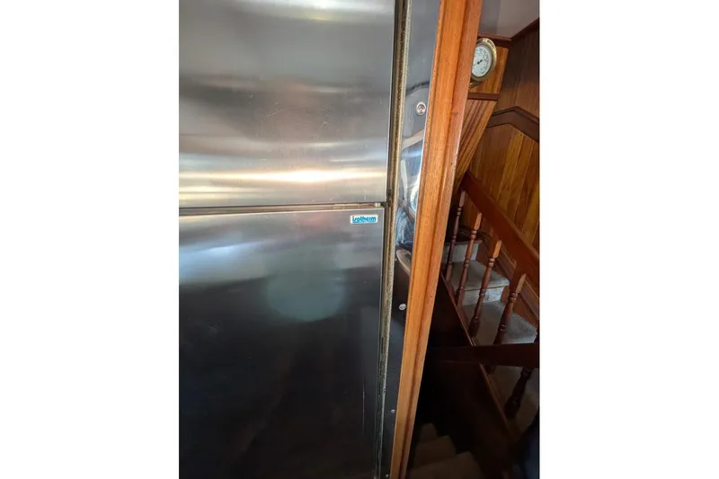 Slide: The Image of Stainless steel refrigerator on 1989 Custom 52 Pilothouse yacht interior. - 27