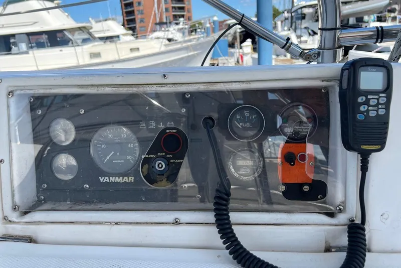 Slide: The Image of Control panel of a 2005 Hunter 44 Deck Salon sailboat with Yanmar engine gauges. - 11