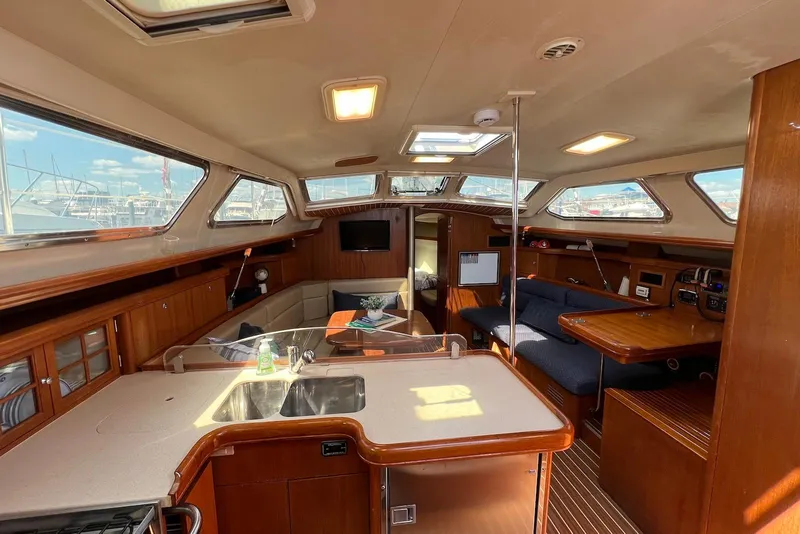 Slide: The Image of Interior of 2005 Hunter 44 Deck Salon yacht with spacious seating and modern amenities. - 30
