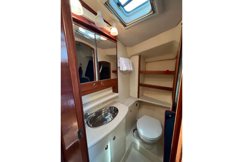 Slide: The Image of Luxurious bathroom in 2005 Hunter 44 Deck Salon yacht with skylight and modern amenities. - 42