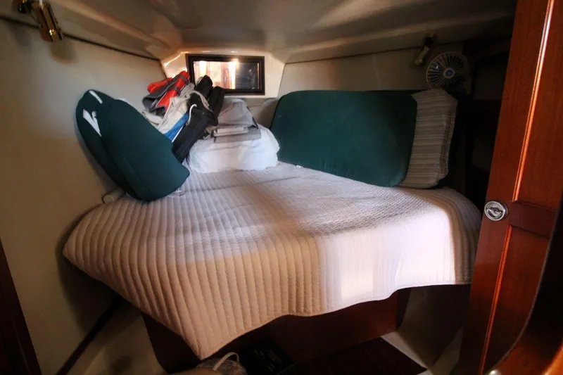 Slide: The Image of Cozy cabin interior of 1991 Hunter 37.5 sailboat with bed and cushions. - 11